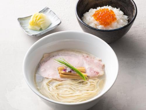 a white bowl of soup with noodles and rice at APA Hotel Ikebukuro Eki Kitaguchi in Tokyo