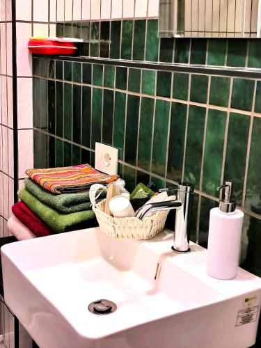 a bathroom with a sink with a basket on it at la Brunita in Rubiera
