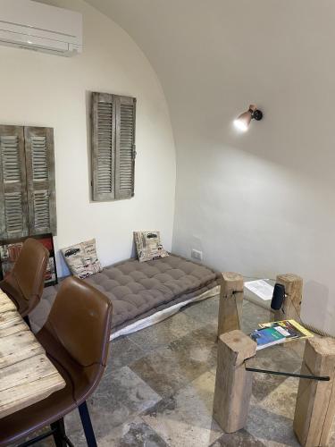 a room with a bed in the corner of a room at The Charming House by 1722 in Ville-di-Paraso