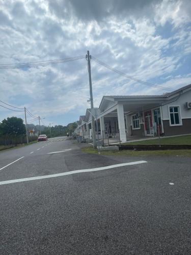 a row of houses on the side of a street at Orked Home2stay in Tampin