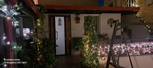 a room with lights and plants on the wall at Zoe garden home in Spáta