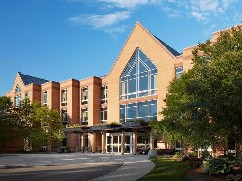 a large brick building with a large window at Haworth Hotel at Hope College in Holland