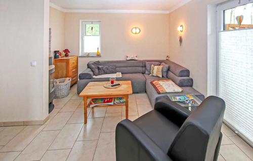 a living room with a couch and a table at Ferienwohnung Bodstedt in Bodstedt