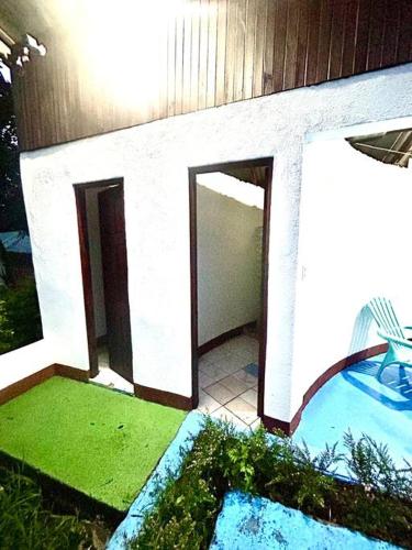 a swimming pool next to a building with a swimming pool at Miravalles Country House in Guayabal