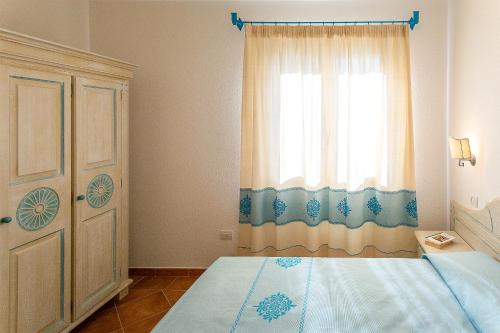 Katil atau katil-katil dalam bilik di Residence in Orosei, apartments 4 beds with air conditioning