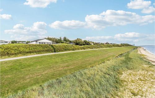 a road leading down to the beach with houses at Stunning Home In Esbjerg V With Wifi in Esbjerg