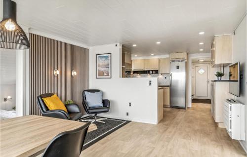 a kitchen and living room with a table and chairs at Stunning Home In Esbjerg V With Wifi in Esbjerg