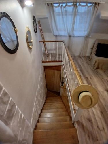 a staircase with a toilet in a room at Au Petit Wissant in Marquise