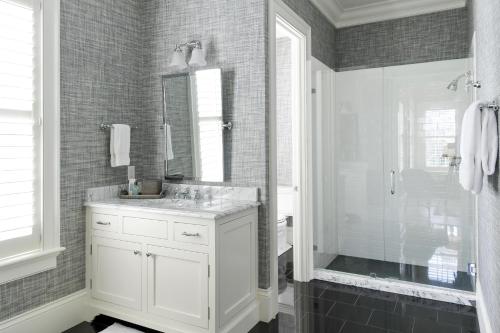 a bathroom with a white sink and a shower at Signature 5 Bedroom Lagoon Residence 1003 in Bluffton
