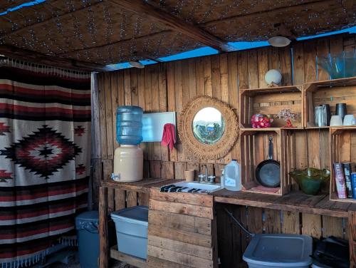 a bathroom with a sink and a toilet in a room at La Window Glamping in La Ventana