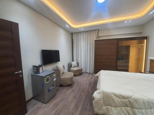 TV a/nebo společenská místnost v ubytování New Cairo rooms