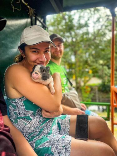 a woman holding a small animal in her arms at Hotel y Parque Turístico Navar City in Villavicencio