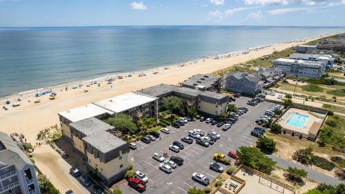 an aerial view of a beach and a parking lot at Oceanfront 2 Bedroom Condo at Golden Strand in Kill Devil Hills
