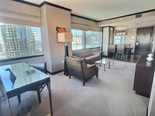 a living room with a couch and a table at Jet Luxury at The Vdara in Las Vegas