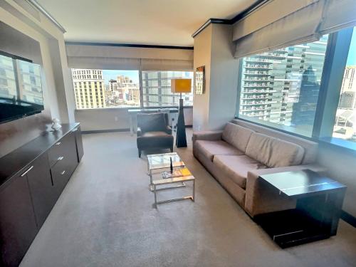 a living room with a couch and a table at Jet Luxury at The Vdara in Las Vegas