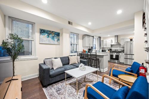 a living room with a couch and a table at Spacious 3-Bedroom Apt in the Heart of Philly in Philadelphia
