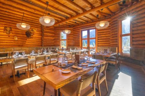 a large dining room with a long table and chairs at The Lodge at Bow Lake in Lake Louise