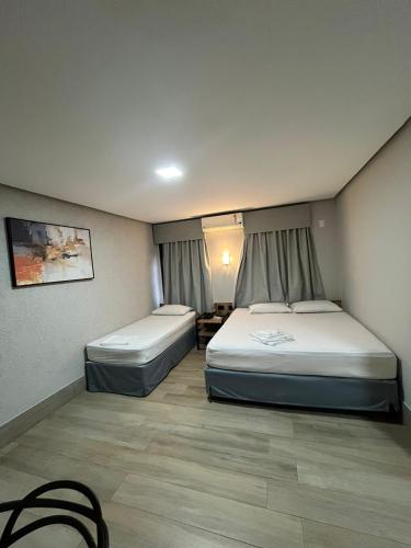 Postel nebo postele na pokoji v ubytování Hotel Graal Inn Uberaba