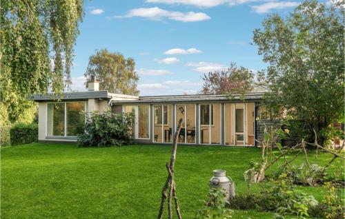 an exterior view of a house with a yard at Awesome Home In Føllenslev With Wifi in Føllenslev
