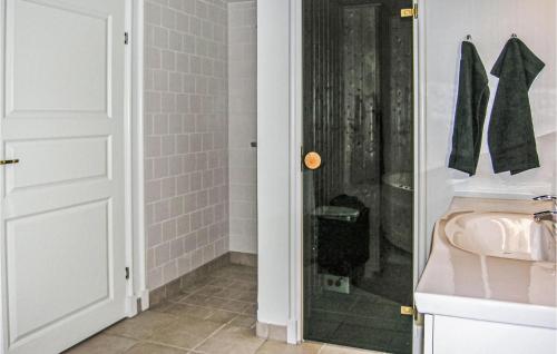 a bathroom with a shower and a sink at Apartment Færgevej X in Bagenkop