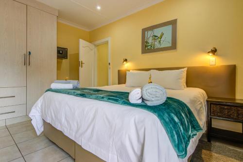 Un ou plusieurs lits dans un hébergement de l'établissement Edenvale Guest House