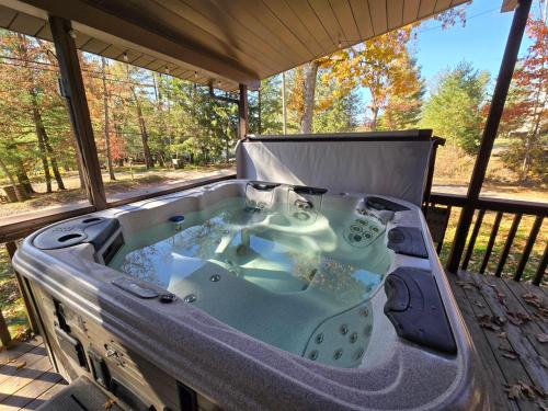 a hot tub sitting on a deck in avisor at Slips and Slopes in McHenry