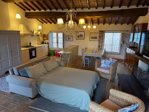 a living room with a couch and a table at 2 King Bed, 2 Full Bathroom Apartment in Umbria - Tuscany in Città della Pieve