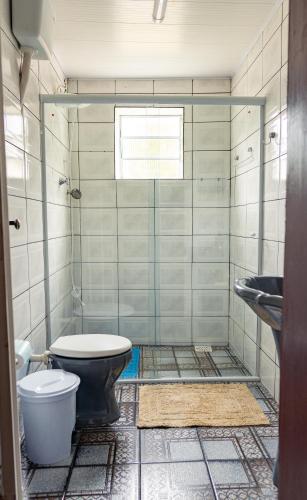 a bathroom with a toilet and a sink at Sobrado da Prainha in Tiradentes