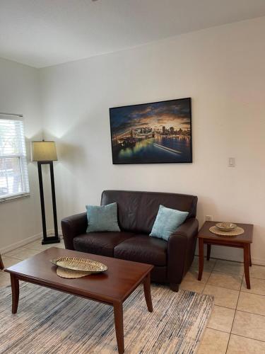 a living room with a couch and a coffee table at Sarasota -Walk to Siesta Key Beach in Sarasota