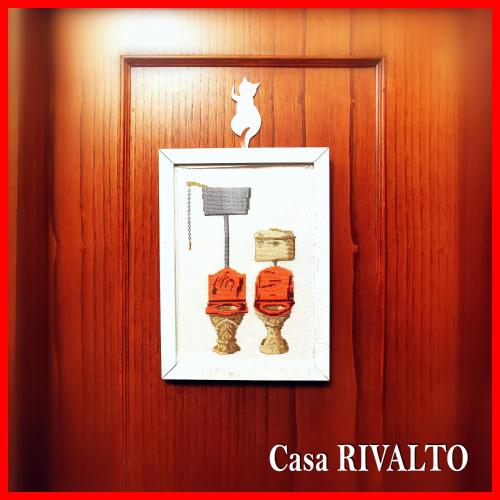 a picture on a wooden door with a picture on it at Casa RIVALTO - Antiche Dimore Pisane in Rivalto