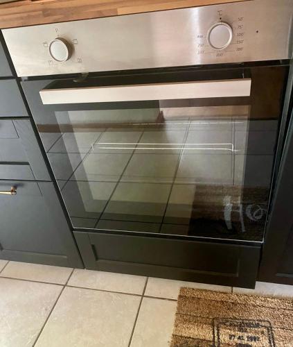 an oven with a glass door in a kitchen at Ferienwohnung in Stein AR in Stein