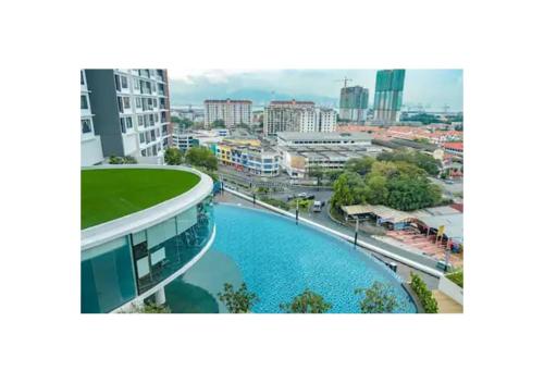 a view of a city with a building and a river at ROMANCE FULL HOUSE THREE PREMIER SUITE in Butterworth