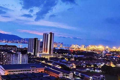 a view of a city at night at ROMANCE FULL HOUSE THREE PREMIER SUITE in Butterworth