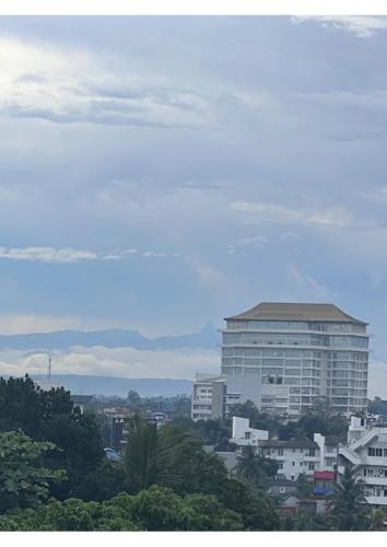 a city with a large building in the background at The Luxor Roof16 in Battaramulla