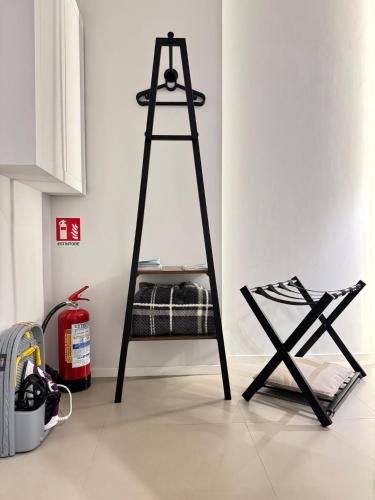 a black ladder with a bunk bed in a room at Luxury apartment - SUITE CAVOUR in Bari