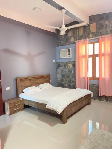 Una cama o camas en una habitación de Jabal Shams Villa