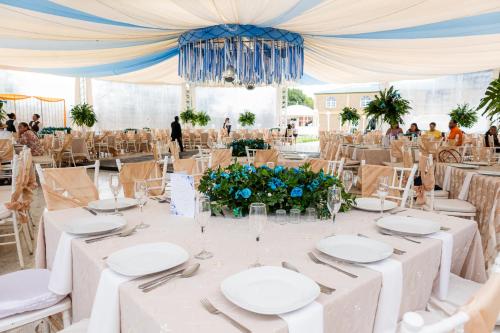 a table set up for a wedding in a marquee at Villas del Sol Hotel & Bungalows in Oaxaca City