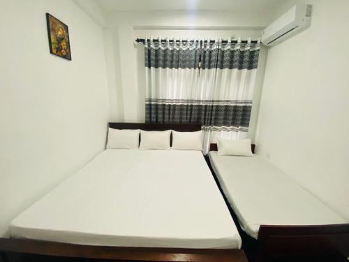 Postel nebo postele na pokoji v ubytování Induwara Holiday home