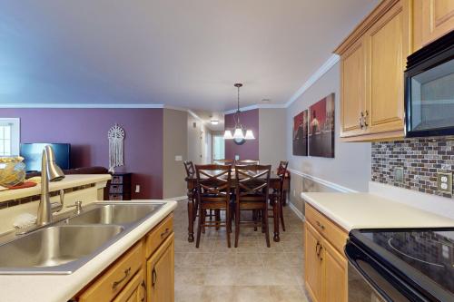 a kitchen with a sink and a dining room at Sterling Pointe 120-A at Wachesaw III in Myrtle Beach