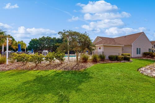 a house with a yard with a pool at Sterling Pointe 120-A at Wachesaw III in Myrtle Beach
