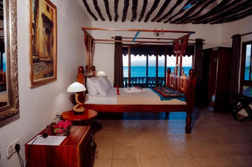 Postel nebo postele na pokoji v ubytování Langi Langi Beach Bungalows