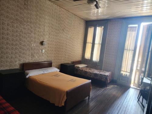 Кровать или кровати в номере Hotel Pueyrredón