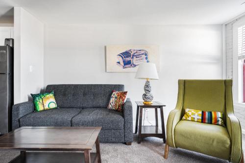 a living room with a couch and a chair at Spacious 2BR Apt on Mass Ave w Kitchen in Indianapolis