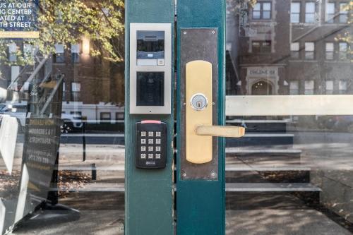 a pay telephone booth with a remote control on it at Spacious 2BR Apt on Mass Ave w Kitchen in Indianapolis