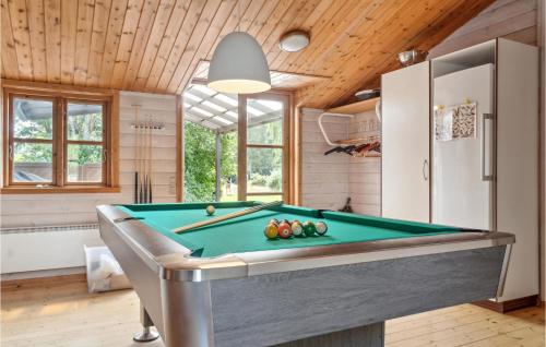 a kitchen with a pool table in a room at Amazing Home In Stege With Kitchen in Stege