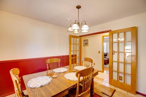 a dining room with a wooden table and chairs at Fish, Hike and Sightsee Lovely Florissant Cabin! in Florissant
