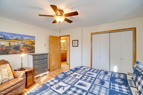 a bedroom with a bed and a ceiling fan at Fish, Hike and Sightsee Lovely Florissant Cabin! in Florissant