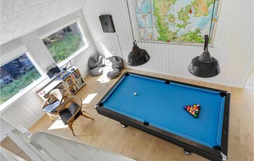 an overhead view of a pool table in a room at Lovely Home In Blokhus With Sauna in Blokhus