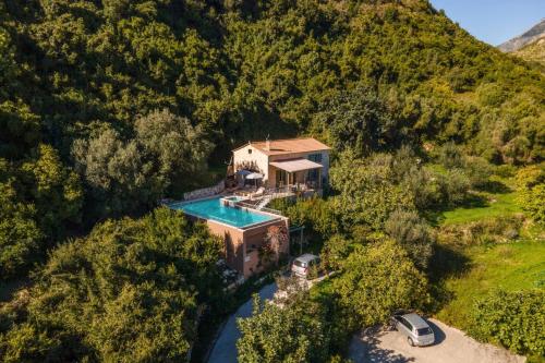 an aerial view of a house with a swimming pool at Villa Katelios Bay View by Villa Plus in Katelios