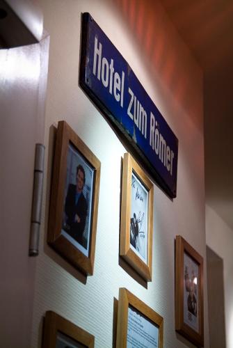 a hotel zim terrorist sign on a wall with pictures at Hotel Restaurant Roemer in Merzig